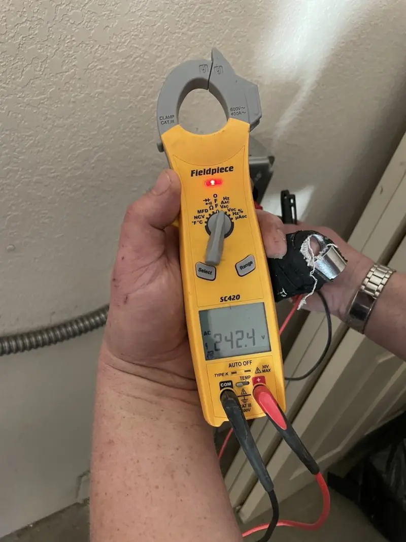 Voltage testing with clamp meter during Outlet Installation in Hawthorne